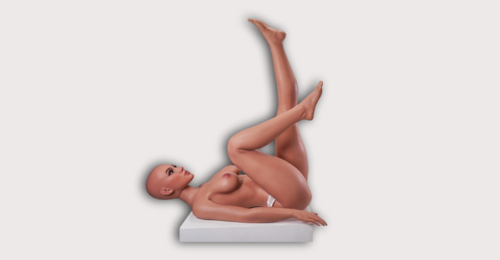 Sex doll with legs in the air.